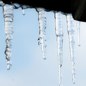 icicles hanging off of a roof